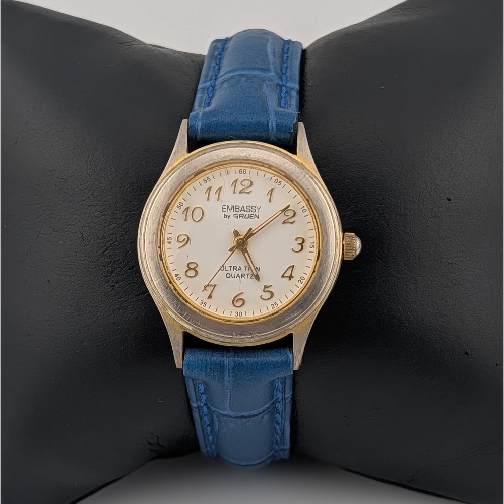 Embassy‎ by Gruen Ultra Thin Quartz Watch Gold Tone White Dial Blue Strap W1780